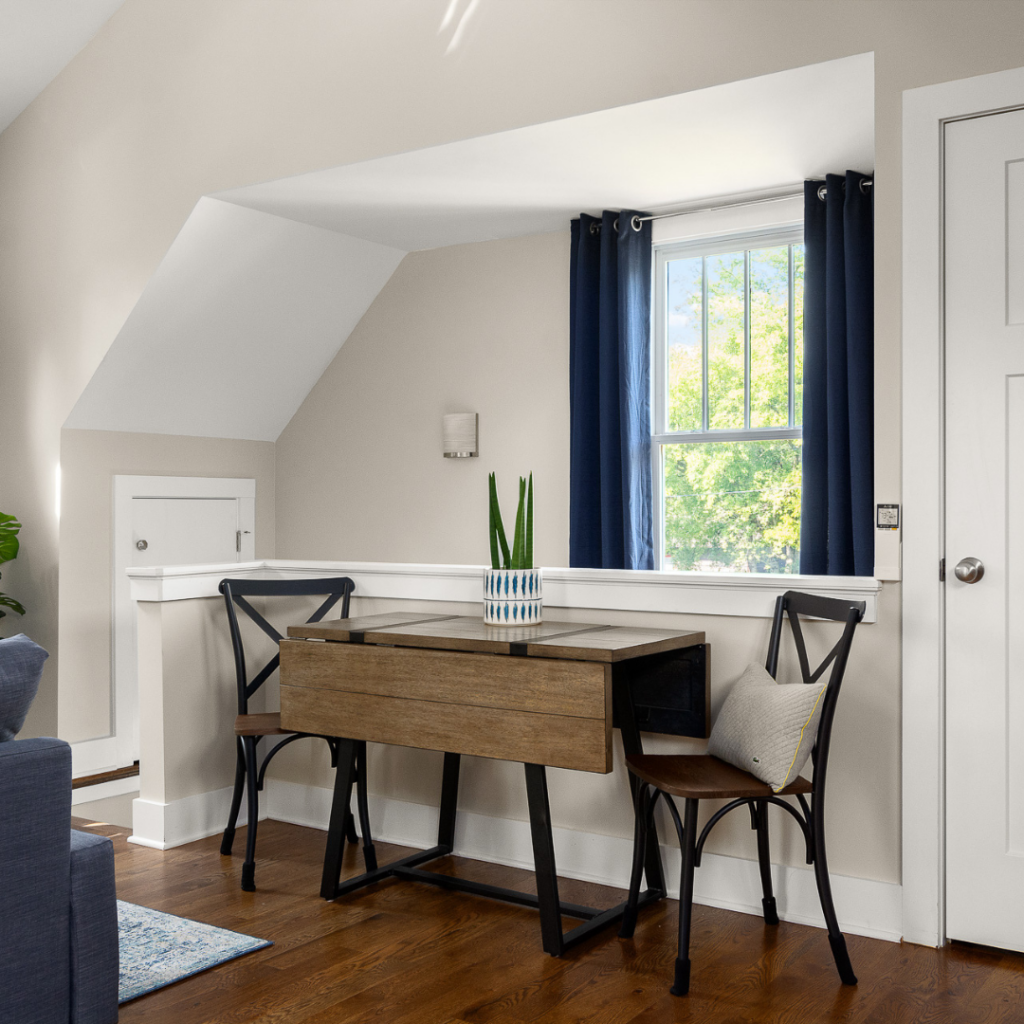 Cozy DADU interior with a dining nook, wood flooring, and natural light.