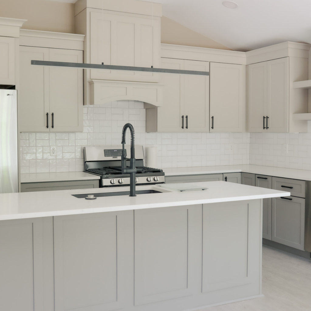 Modern DADU kitchen with shaker cabinets, quartz countertops, and a black faucet.