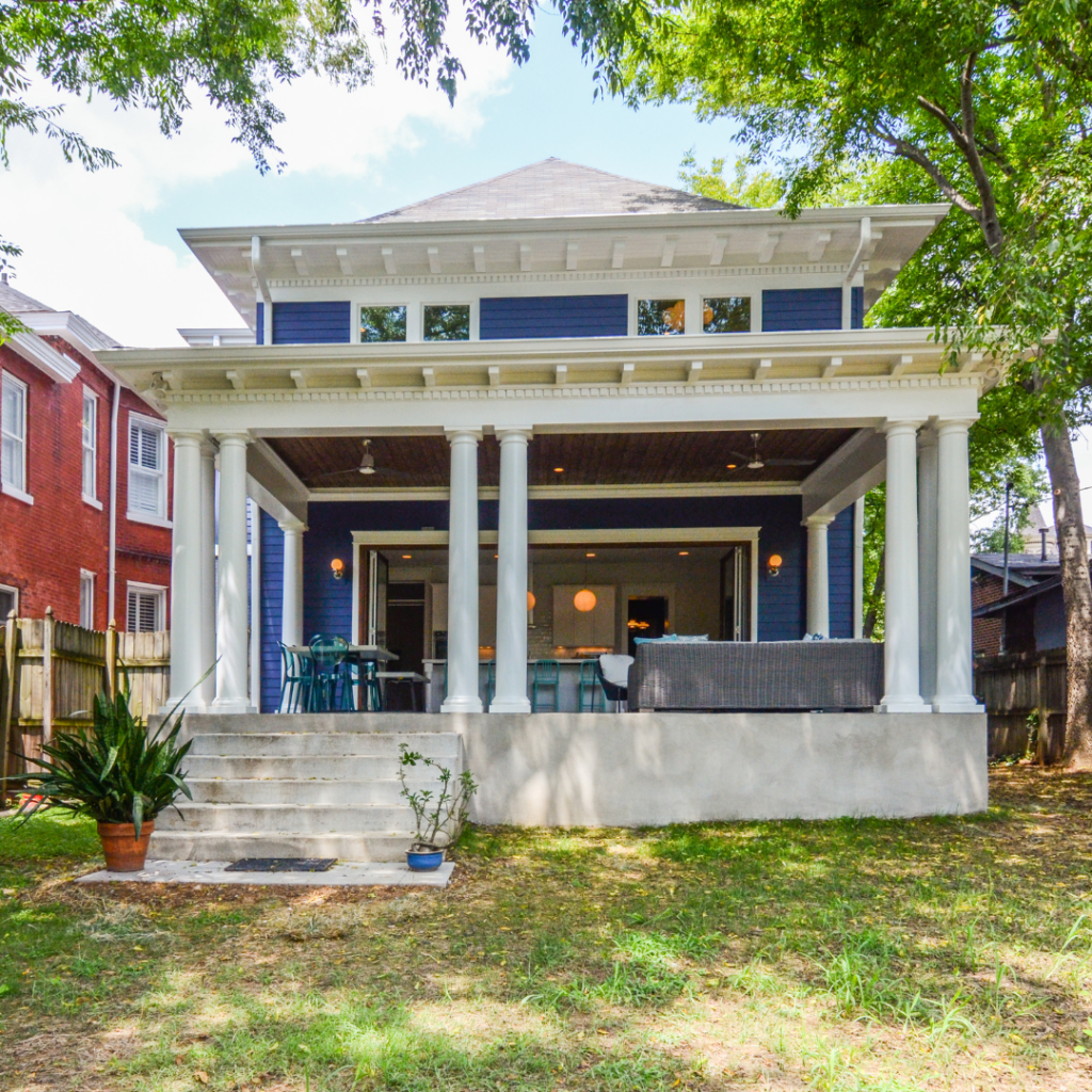 Restored historic home with a grand front porch in Nashville, TN, featuring classic columns and modern updates.