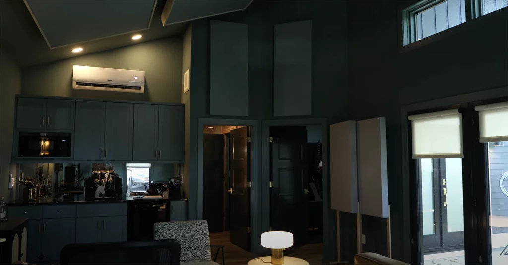 East Nashville custom build music studio interior with high ceilings, natural light and modern blue green walls and brass finishes